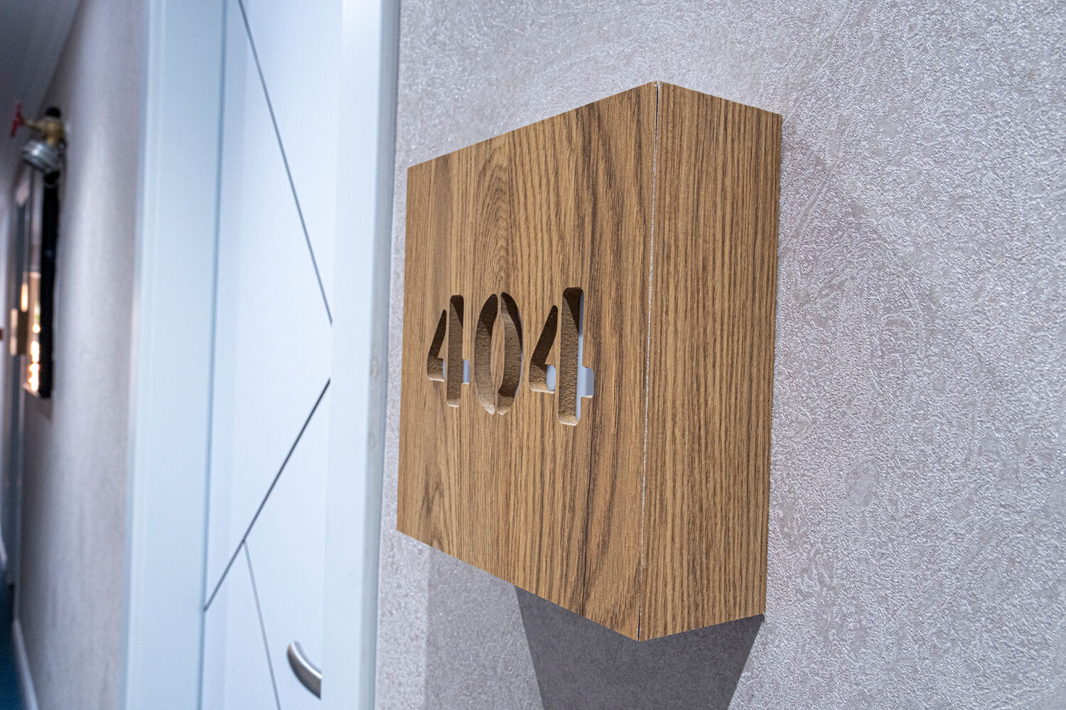 Explore a stunning modern resort featuring a sleek swimming pool surrounded by palm trees.